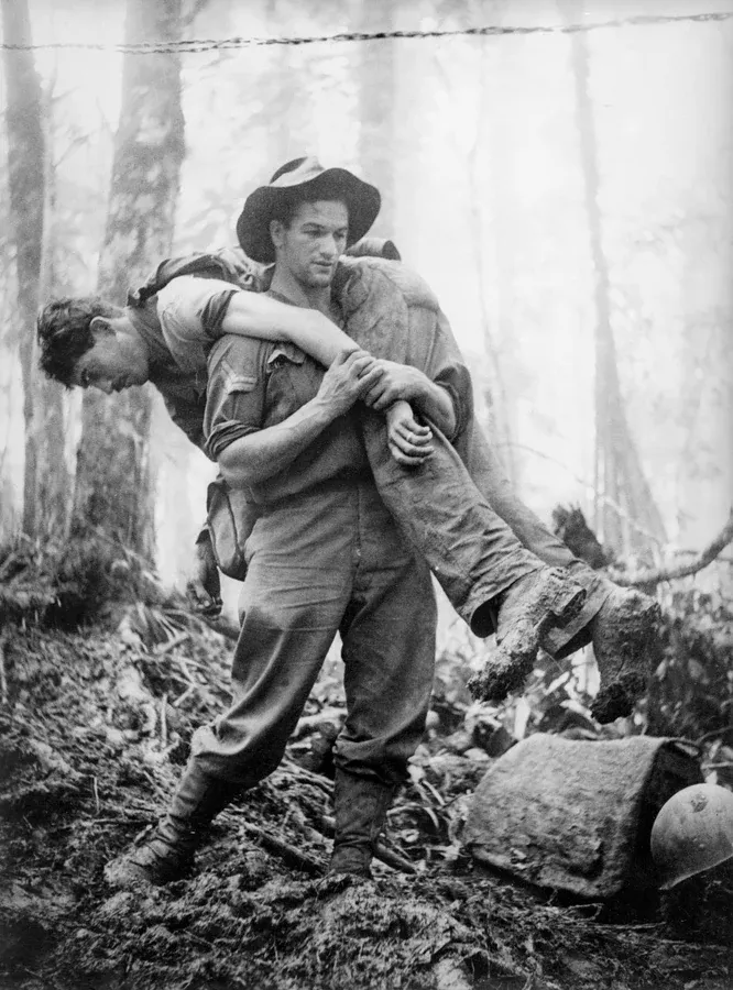 Historic Kokoda image of a soldier being carried